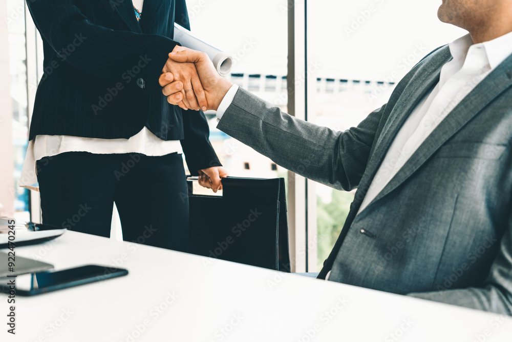Businessman executive handshake with businesswoman worker in modern workplace office. People corporate business deals concept. uds Businessman executive handshake with businesswoman worker in modern workplace office. People corporate business deals concept. uds