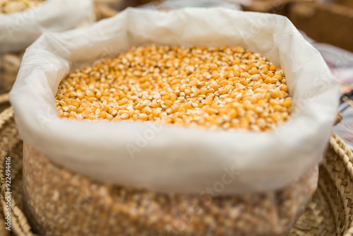 a basket full of corn at a market photo