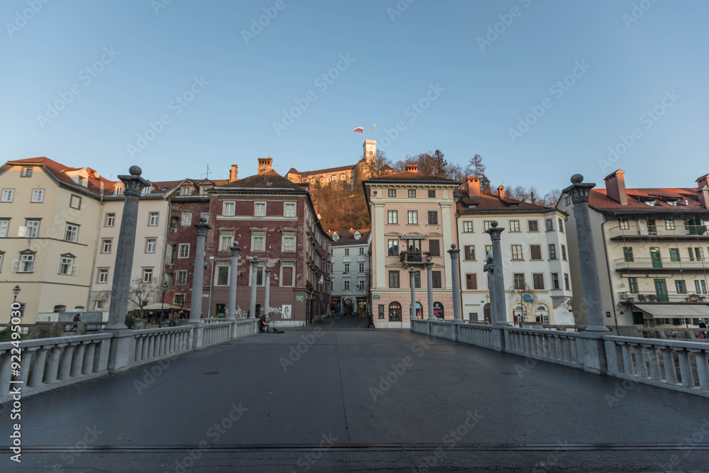 Bridge in the center of Ljubljana, the capital of Slovenia, with the castle in the background on the hill Bridge in the center of Ljubljana, the capital of Slovenia, with the castle in the background on the hill