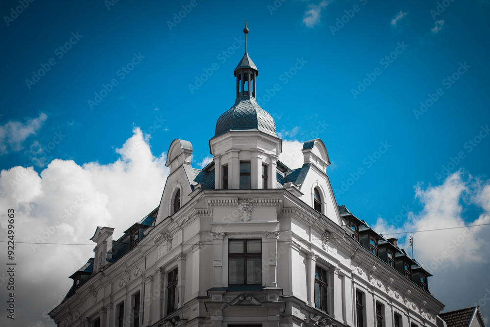 Fototapeta premium Beautiful gothic building of a medieval City Hall in Torun, Poland. Historical street of an ancient European city.