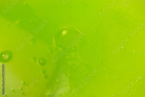 Green slime toy as a background.
