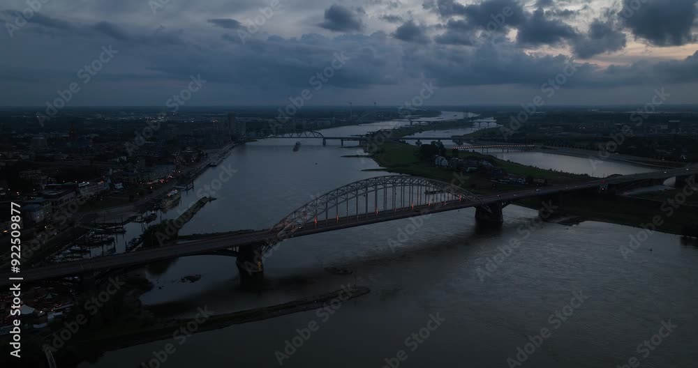 The Waal river, The Waalbrug, played a role in world war 2. Aerial view at night. Nijmegen, The Netherlands. The Waal river, The Waalbrug, played a role in world war 2. Aerial view at night. Nijmegen, The Netherlands.