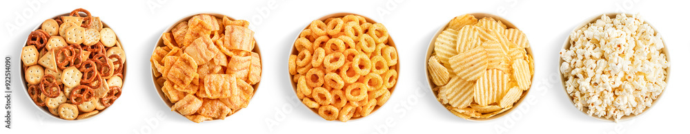 Set of various salty snacks in bowls on white background. Potato chips, popcorn, bacon chips, onion rings, creckers and pretzels Set of various salty snacks in bowls on white background. Potato chips, popcorn, bacon chips, onion rings, creckers and pretzels