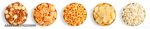 Set of various salty snacks in bowls on white background. Potato chips, popcorn, bacon chips, onion rings, creckers and pretzels