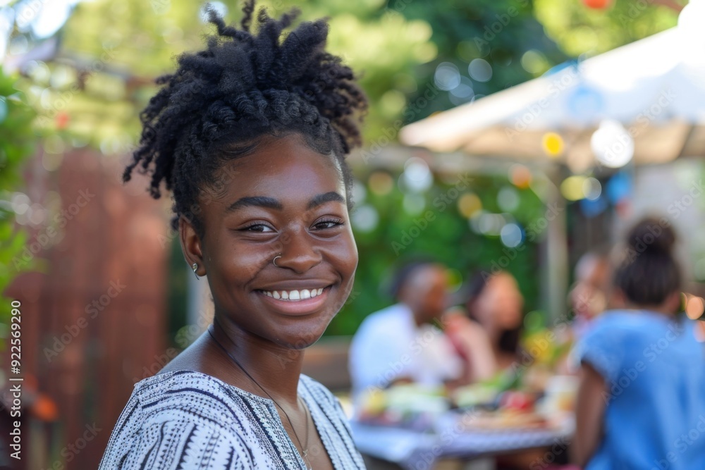 Portrait of a smiling young woman attending a barbecue Portrait of a smiling young woman attending a barbecue