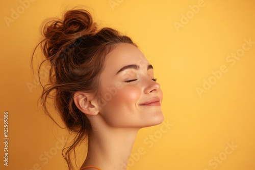 A close up of a woman's face with her eyes closed