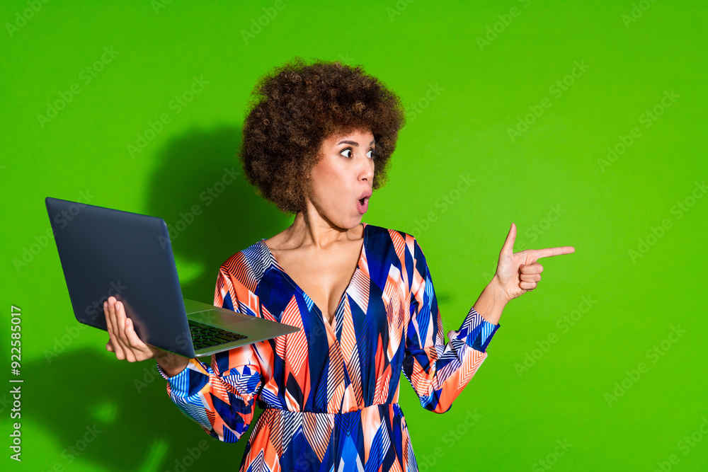 Photo of funny funky attractive woman wear trendy print clothes recommend look empty space isolated on vivid green color background Photo of funny funky attractive woman wear trendy print clothes recommend look empty space isolated on vivid green color background