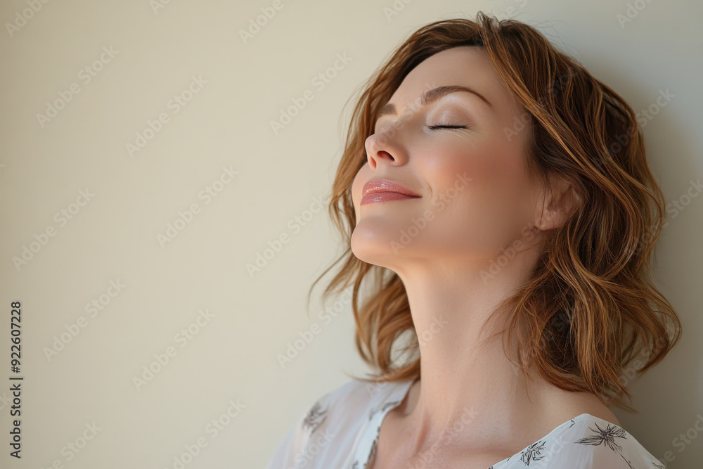 A close up of a woman's face with her eyes closed A close up of a woman's face with her eyes closed