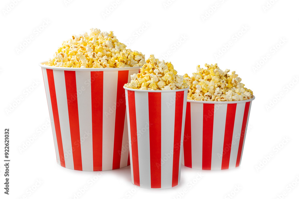 Popcorn box. Red and white striped buckets of salted popcorn isolated on white background. Cinema and entertainment concept. Movie night with popcorn. Delicious appetizer, snack. Popcorn box. Red and white striped buckets of salted popcorn isolated on white background. Cinema and entertainment concept. Movie night with popcorn. Delicious appetizer, snack.