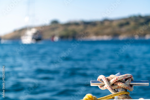 sailors knot in front of the yacht boat. luxury and private concept. boat on the sea, summer cruise vacation. Sailing yacht fishing holidays. islands lifestyle. anchor rope tied. Tourism see view. photo