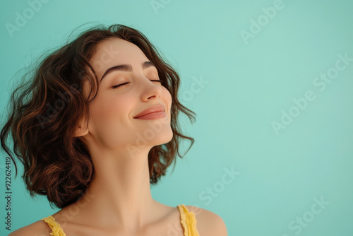 A close up of a woman's face with her eyes closed