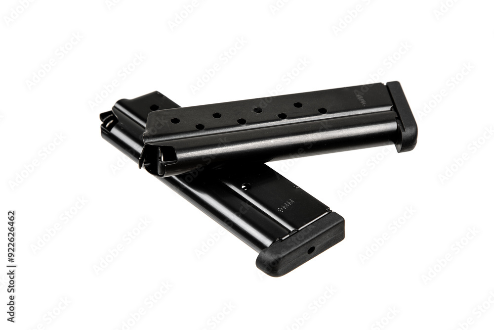 Metal pistol magazine for 9 mm cartridges. Clip for ammunition. Isolate on a white back. Metal pistol magazine for 9 mm cartridges. Clip for ammunition. Isolate on a white back.