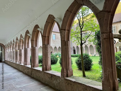 Cloister of the Couvent des Dominicains de Guebwiller Featuring Gothic Arched Walkways Overlooking a Tranquil Courtyard Garden, Florival, Haut-Rhin, Alsace, France