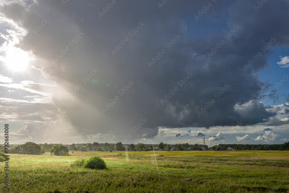 A stormy sky with a bright sun peeking through the clouds A stormy sky with a bright sun peeking through the clouds