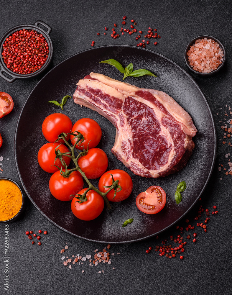 Fresh, raw beef steak with salt, spices and herbs Fresh, raw beef steak with salt, spices and herbs