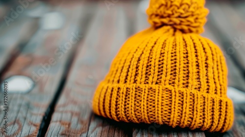 Cozy Knit Yellow Beanie on Wooden Surface in Natural Light