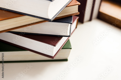a stack of hymnals on a desk