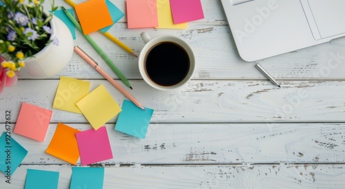 Workspace With Sticky Notes and Stationery on a Light Blue Wooden Table
