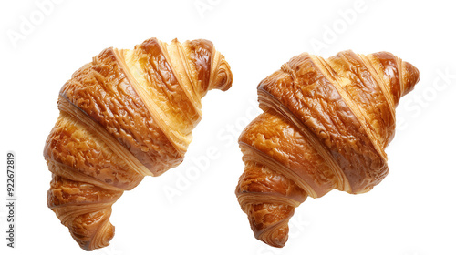 Top view of two nearby lying fresh croissants on a transparent background. PNG image