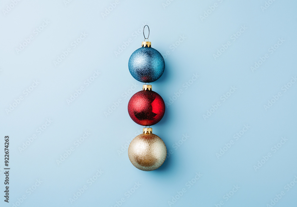 Three Christmas ornaments hanging from a string Three Christmas ornaments hanging from a string