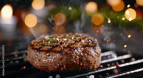 Grilled Steak on a Plate With Herb Garnish Near an Open Flame at Dusk