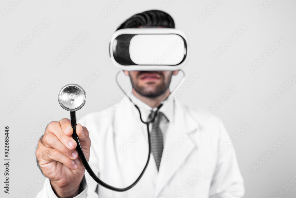 Skilled doctor wear VR glasses and lab coat while hold stethoscope for diagnosis disease. Caucasian doctor looking medical data from virtual reality goggles device. Innovation technology. Deviation. Skilled doctor wear VR glasses and lab coat while hold stethoscope for diagnosis disease. Caucasian doctor looking medical data from virtual reality goggles device. Innovation technology. Deviation.