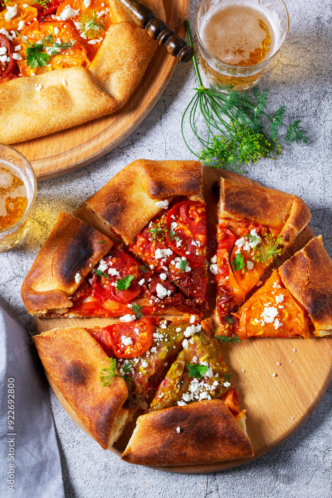 Traditional open pie galette with tomatoes, cheese and herbs, served with beer or wine.