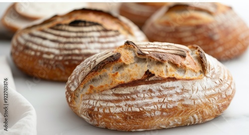 Freshly Baked Artisan Bread on a Wooden Cutting Board in a Light Kitchen