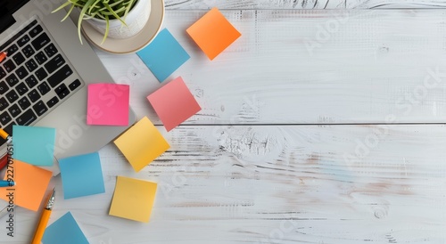 Workspace With Sticky Notes and Stationery on a Light Blue Wooden Table