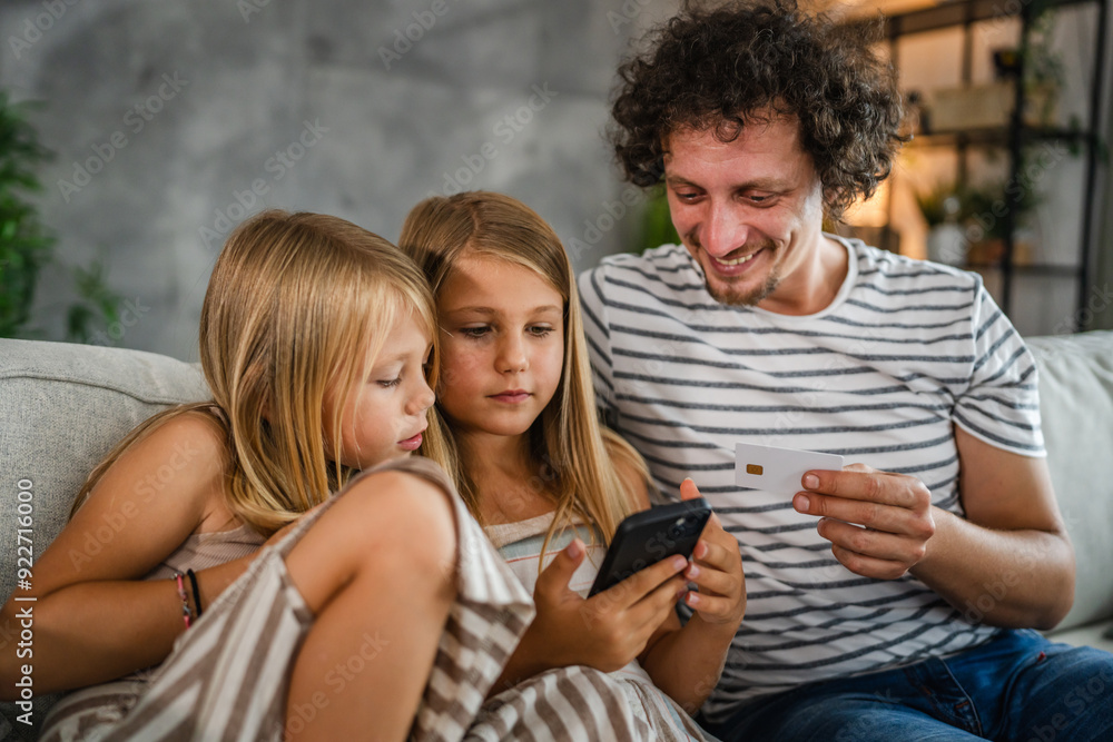 daughters and dad buy online on mobile phone with credit card at home daughters and dad buy online on mobile phone with credit card at home