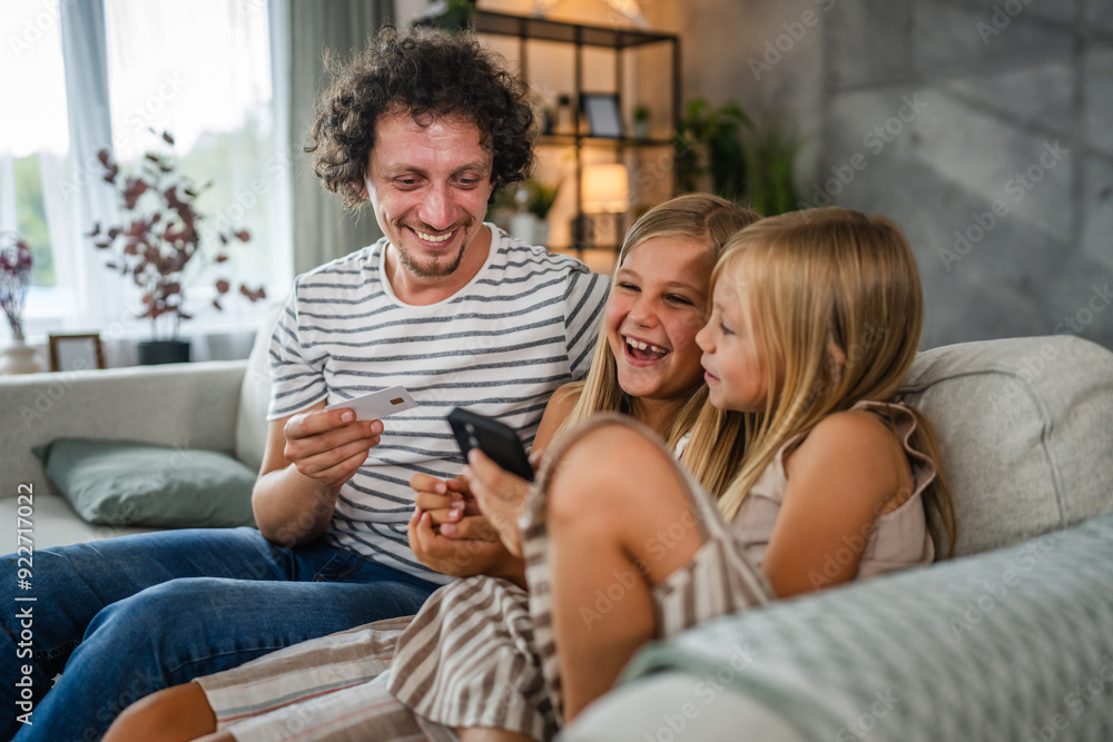 daughters and dad buy online on mobile phone with credit card at home daughters and dad buy online on mobile phone with credit card at home