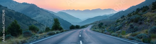 Serene Sunrise Drive: Tranquil Mountain Highway with Pristine Road Conditions and Clear Sky