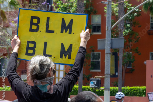 B. L. M. Protest Sign - person holding protest sign photo