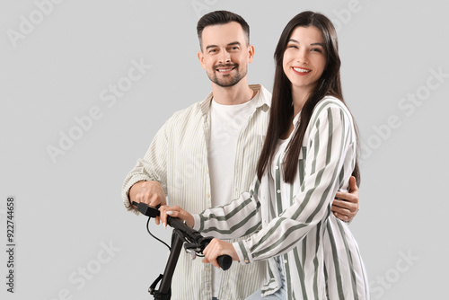Young couple with electric ...