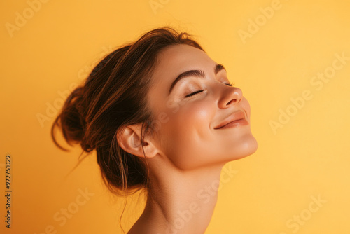 A close up of a woman's face with her eyes closed