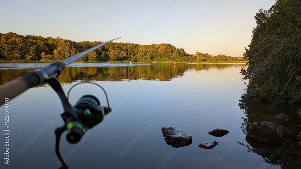 Morning fishing on Corrib river at Galway, Ireland, fishing rod and reel, sport and activities, nature background