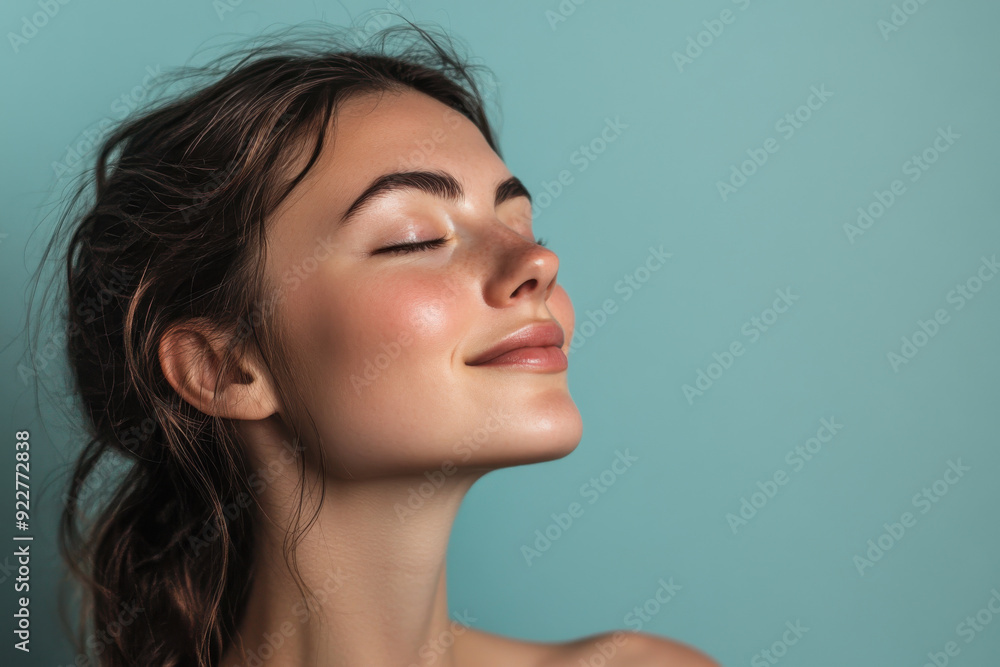 A close up of a woman's face with her eyes closed A close up of a woman's face with her eyes closed