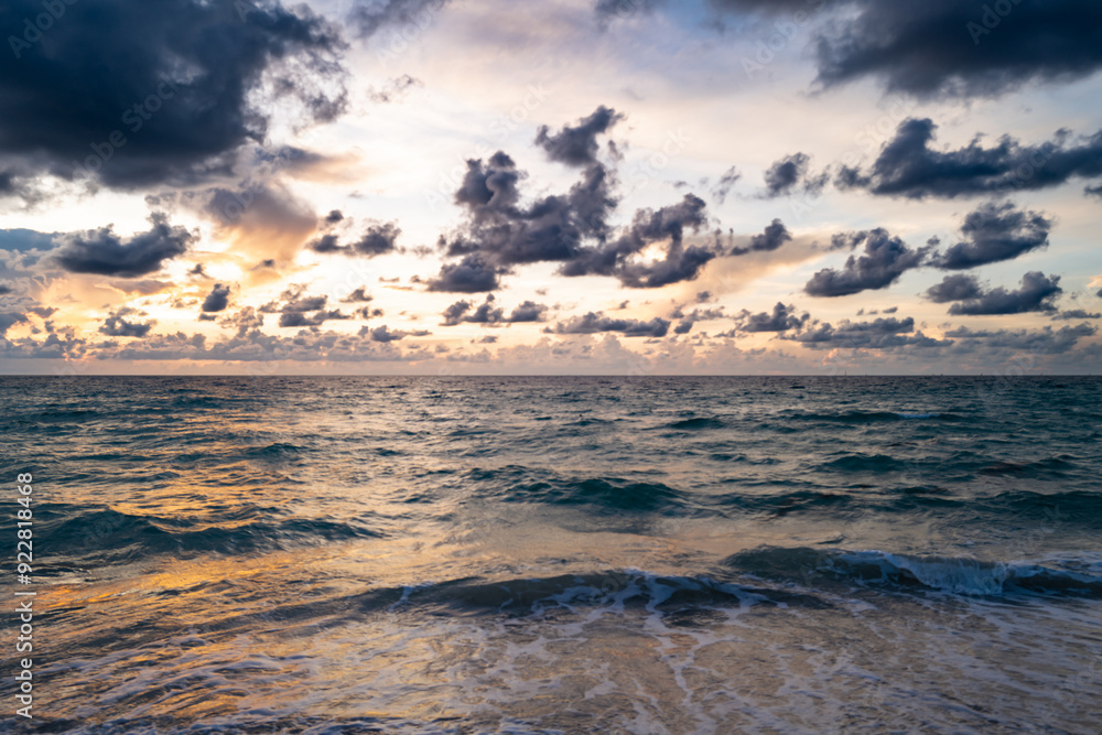 Fototapeta premium Colorful dramatic sky. Big cloud above ocean. Cloud sky with sea background. Amazing dramatic sky sunset background.