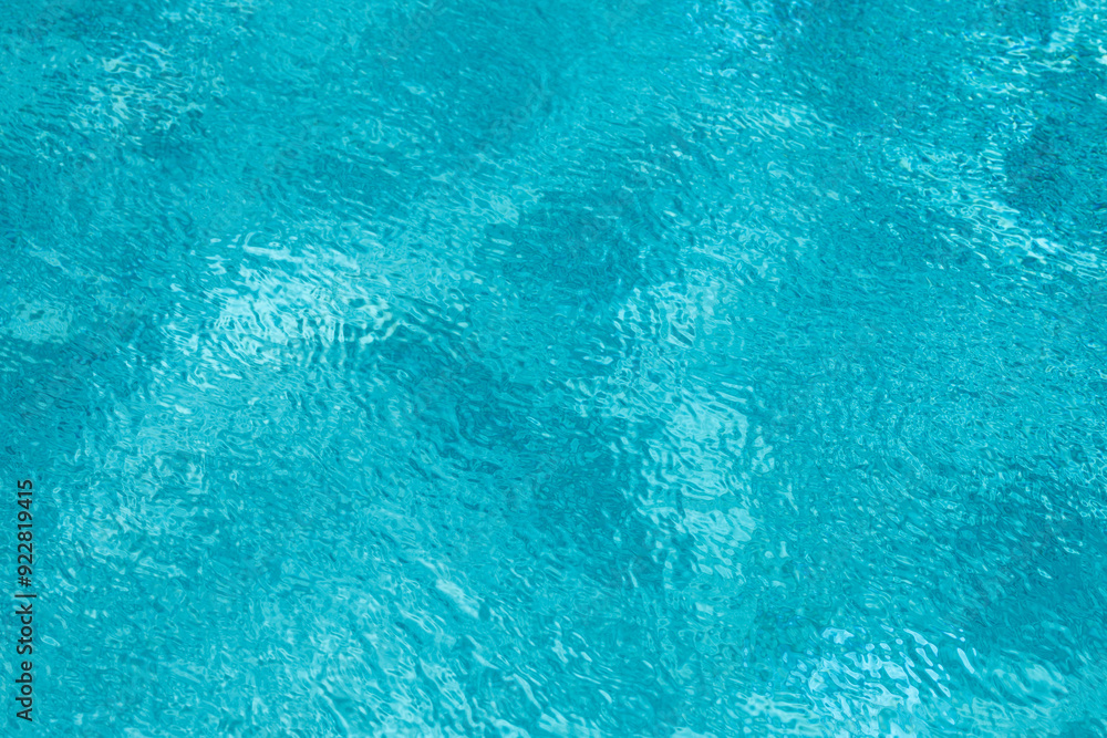 Obraz premium Pool water surface. Blue water texture. Close up blue water surface. Sea surface aerial view. Blue swimming poll water surface. Pattern texture.