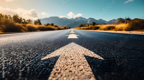 Asphalt Road Symbolism, Long, asphalted road with upward arrows. Symbolizes growth, development, success.Ideal for themes of progress, ambition, and continuous improvement. photo