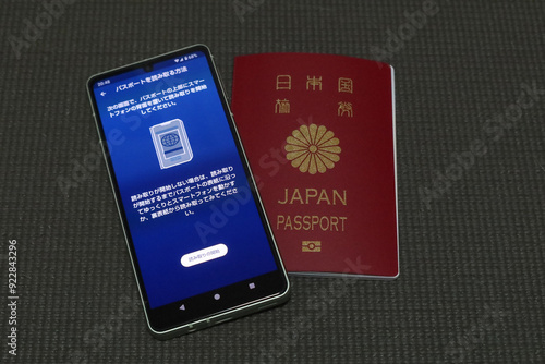 A smartphone with ESTA mobile application screen and a Japanese passport in Tokyo, Japan. August 1, 2024