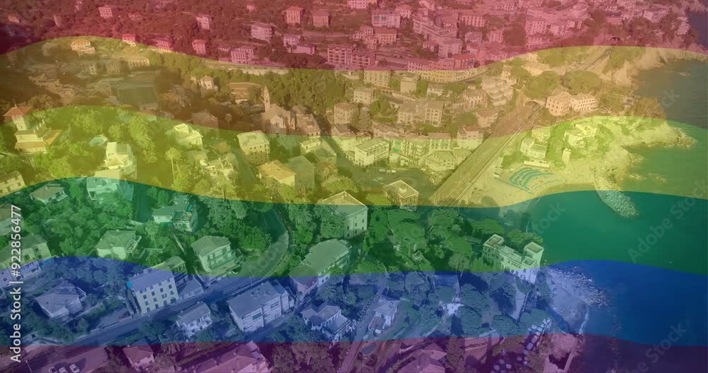 Animating rainbow flag over aerial city view Animating rainbow flag over aerial city view
