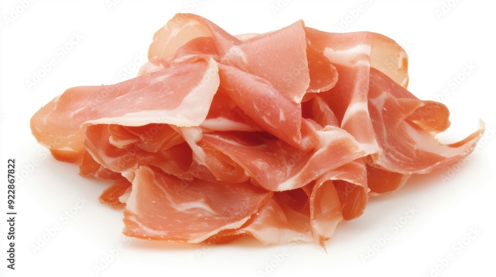 A generous portion of thinly sliced prosciutto waiting to enhance a delicious charcuterie board A generous portion of thinly sliced prosciutto waiting to enhance a delicious charcuterie board