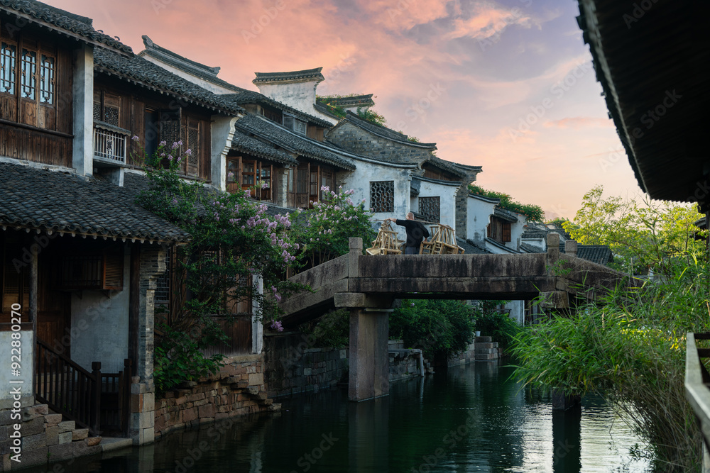 Chinese-style buildings and small bridges by the river. Chinese-style buildings and small bridges by the river.
