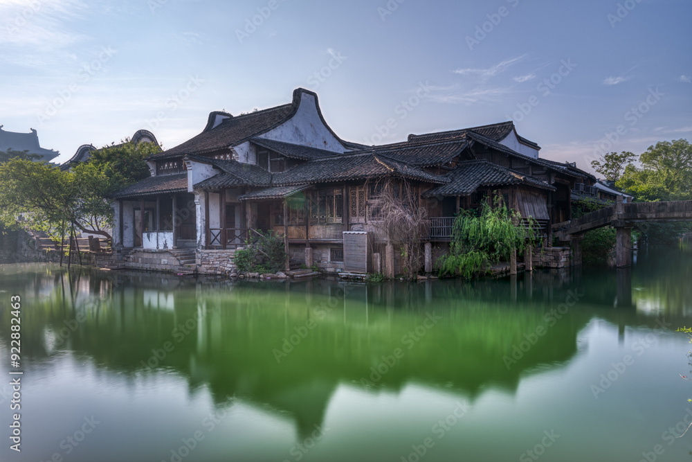 Chinese-style buildings and small bridges by the river. Chinese-style buildings and small bridges by the river.