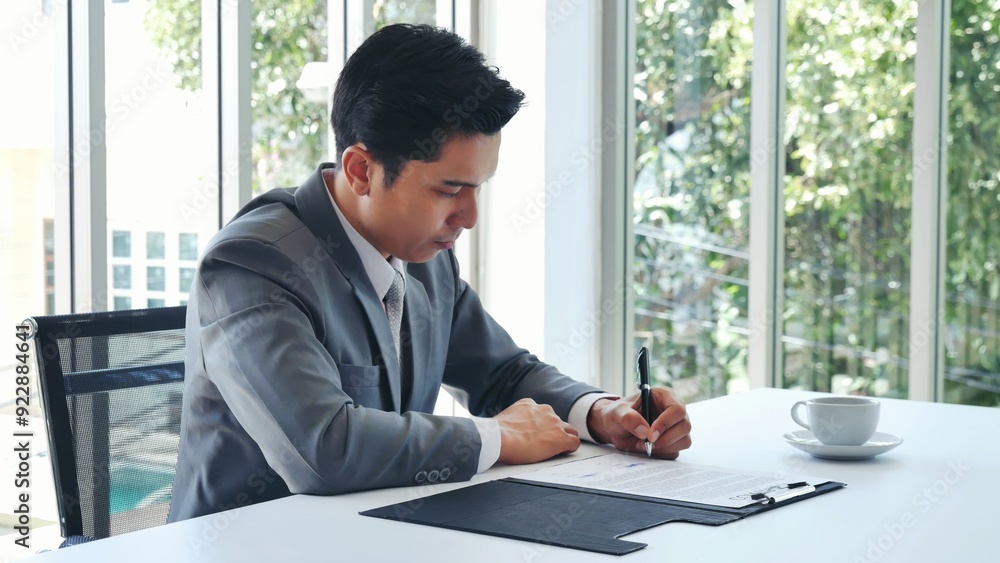 Asian businessman checking document upset disappointed wrong report. Man hands pointing reading paper use pen signing signature writing on agreement. frustrated Businessman manager working in office Asian businessman checking document upset disappointed wrong report. Man hands pointing reading paper use pen signing signature writing on agreement. frustrated Businessman manager working in office