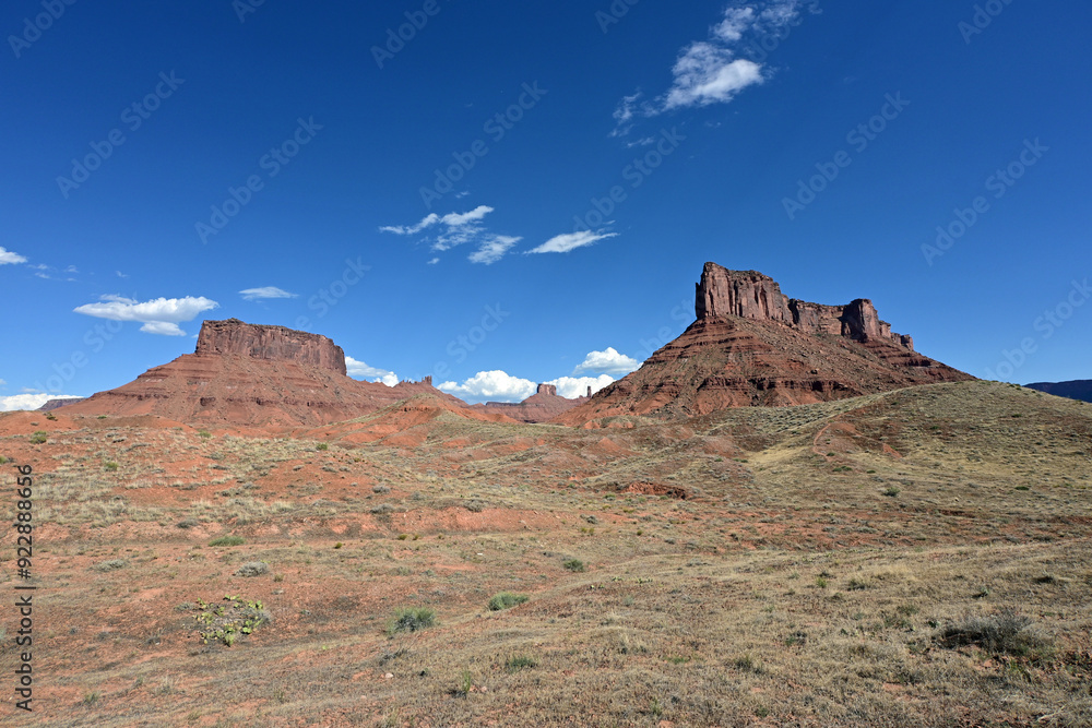 Red rock landscape along Utah State Route 128 near Moab on sunny summer afternoon. Red rock landscape along Utah State Route 128 near Moab on sunny summer afternoon.