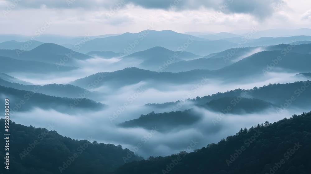 Misty Mountain Landscape with Layers of Fog and Blue Hues Misty Mountain Landscape with Layers of Fog and Blue Hues