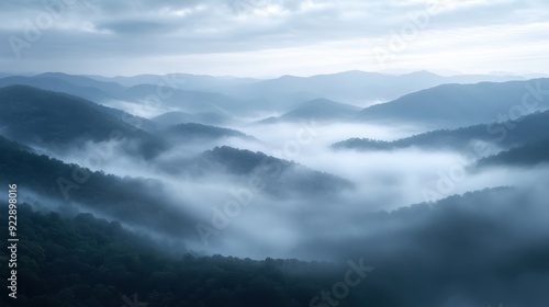 Misty Mountain Landscape with Rolling Hills and Fog