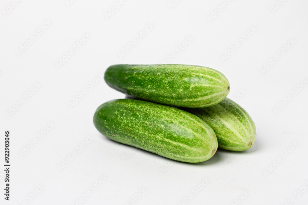 Whole and cut long cucumbers isolated on white Whole and cut long cucumbers isolated on white